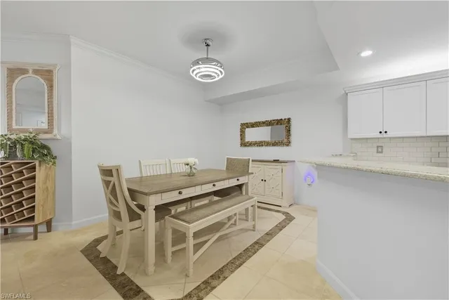a kitchen with stainless steel appliances kitchen island granite countertop a sink and cabinets