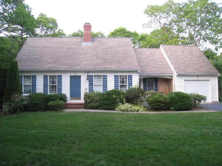 28 Goose Point Road Centerville, MA 02601 - Photo 1 of 33 a front view of a house with a yard and garage