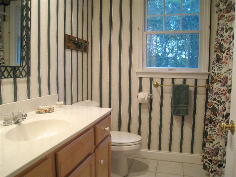 28 Goose Point Road Centerville, MA 02601 - Photo 26 of 33 a bathroom with a sink a toilet and shower