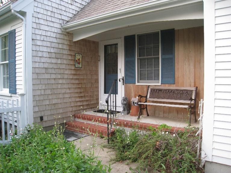 28 Goose Point Road Centerville, MA 02601 - Photo 3 of 33 a view of a bench in front of house