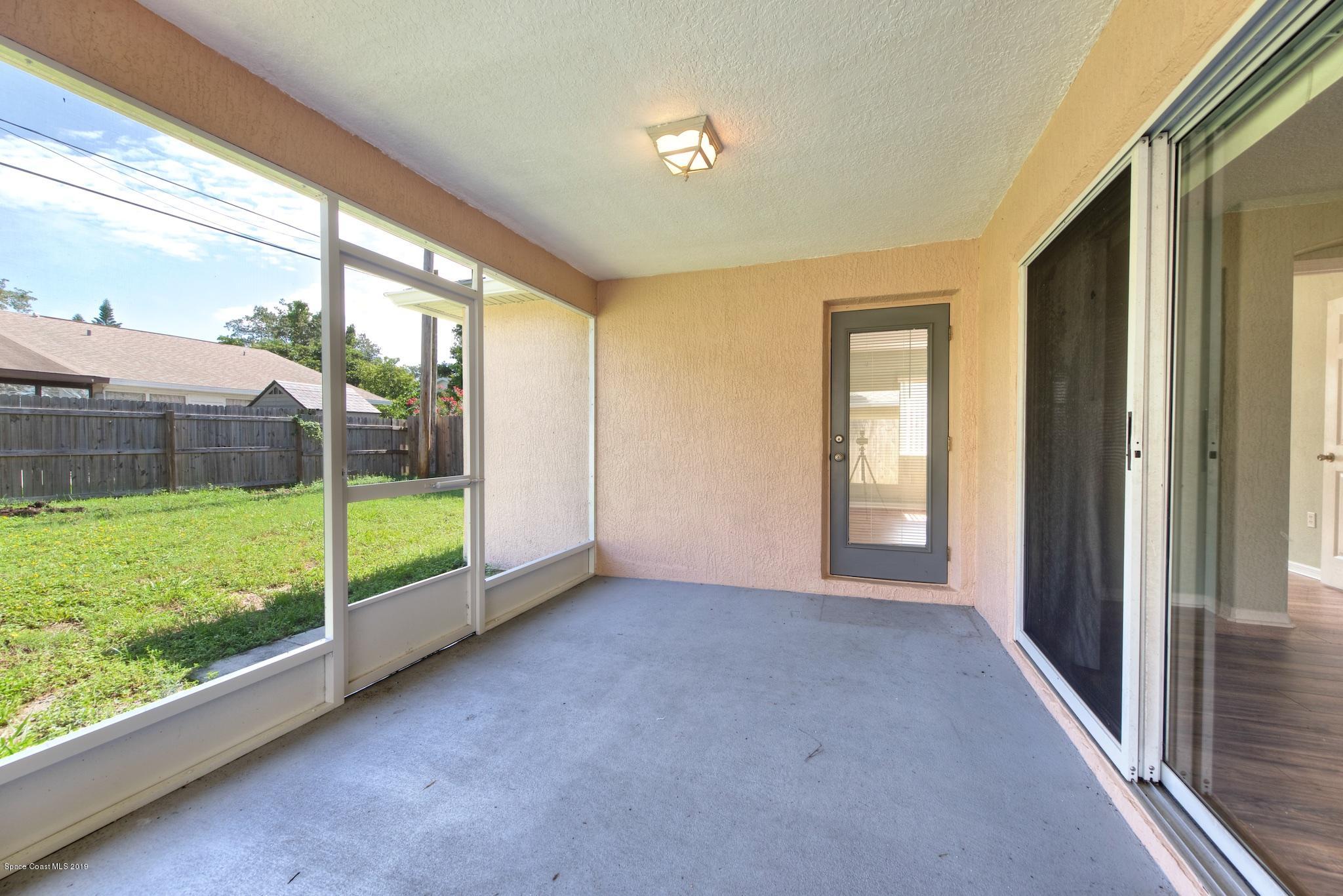1768 Palm Ridge Road Melbourne, FL 32935 - Photo 18 of 20 a view of an empty room with a large window