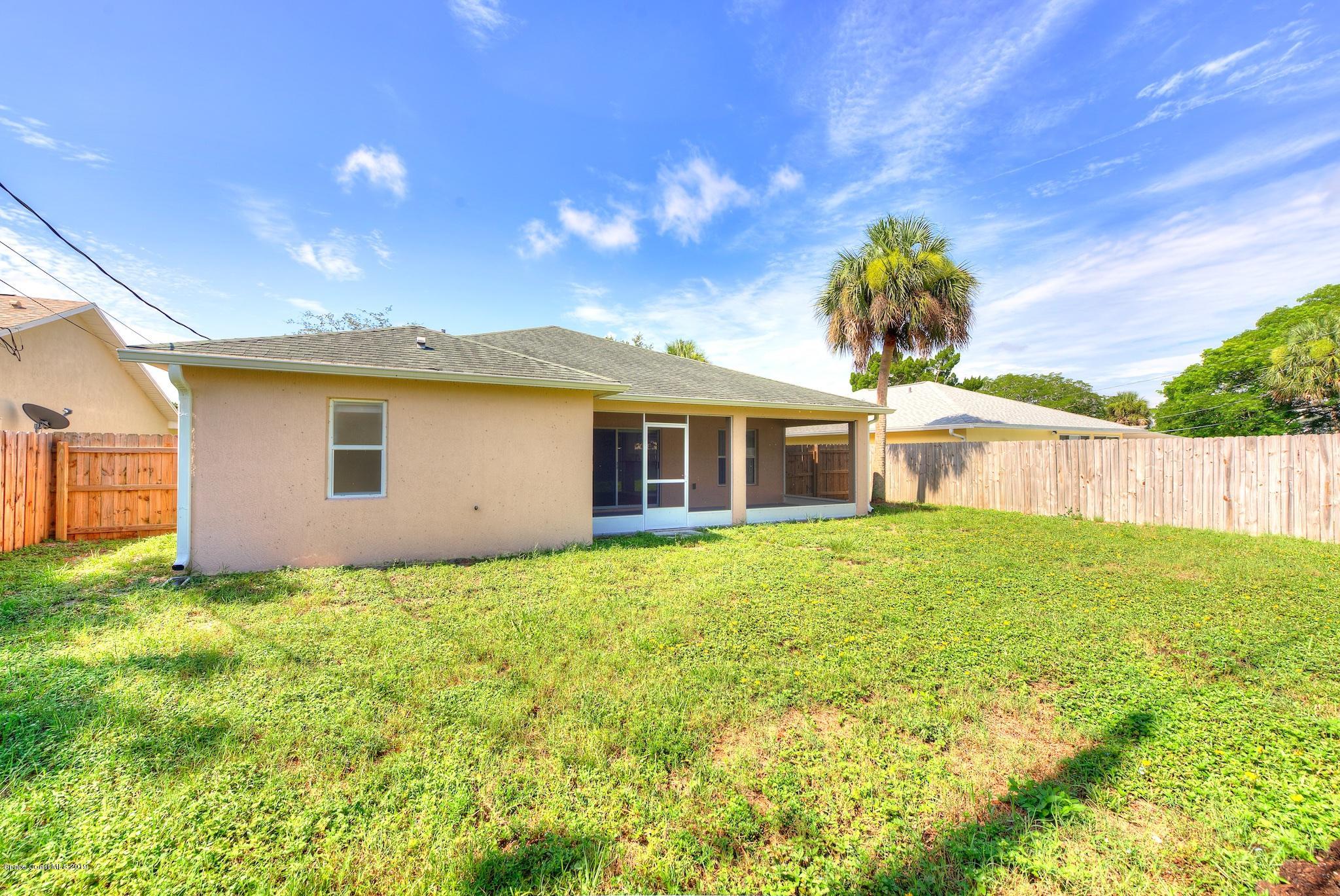 1768 Palm Ridge Road Melbourne, FL 32935 - Photo 19 of 20 a view of a house with backyard