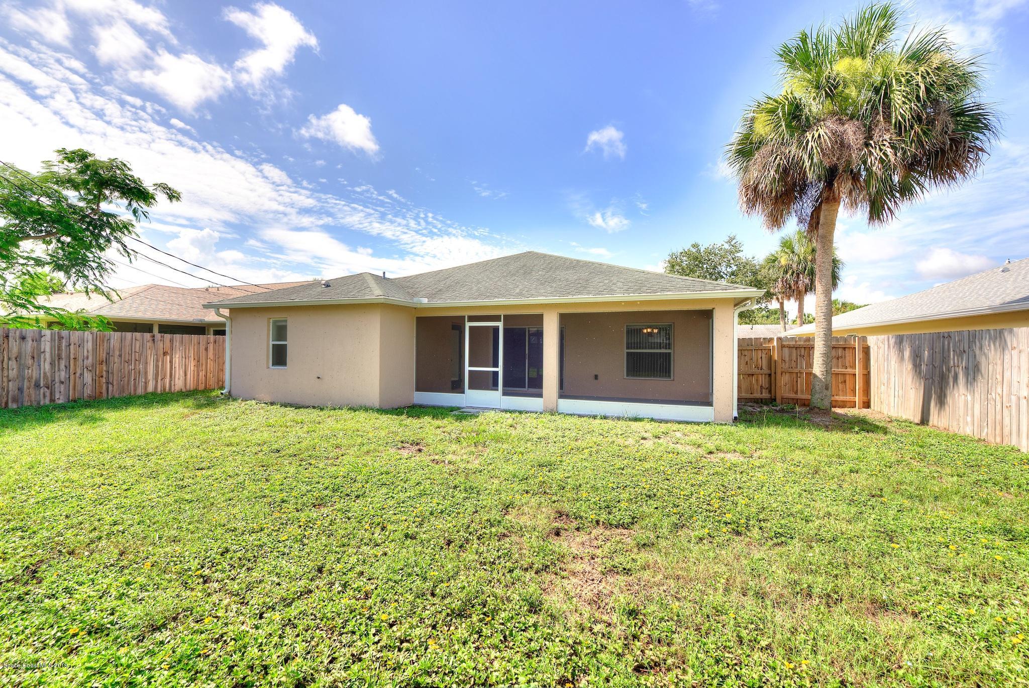 1768 Palm Ridge Road Melbourne, FL 32935 - Photo 20 of 20 a view of a house with a garden