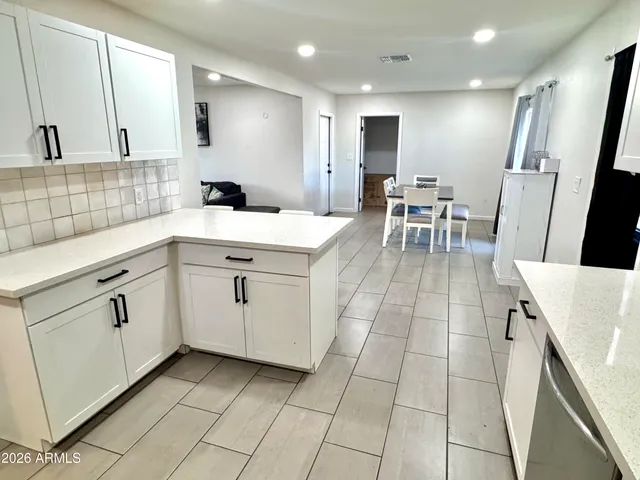 a kitchen with a sink stove and refrigerator