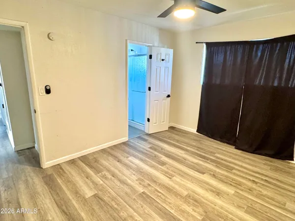 a view of a livingroom with wooden floor and closet