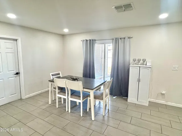 a view of kitchen with furniture and wooden floor