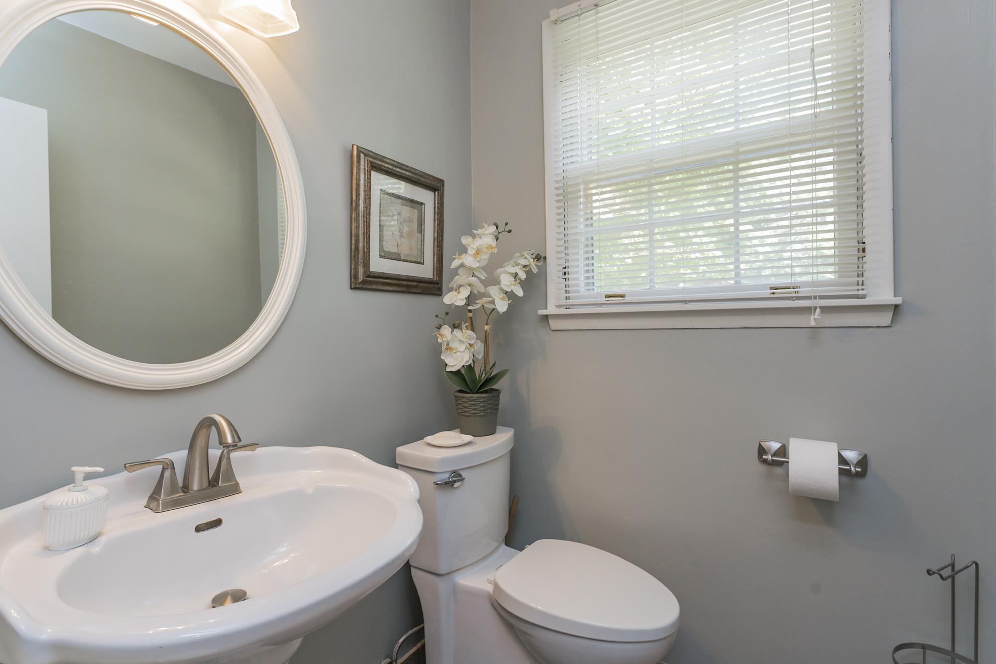 605 Baton Rouge Court Hermitage, TN 37076 - Photo 12 of 24 a bathroom with a sink a toilet and a mirror