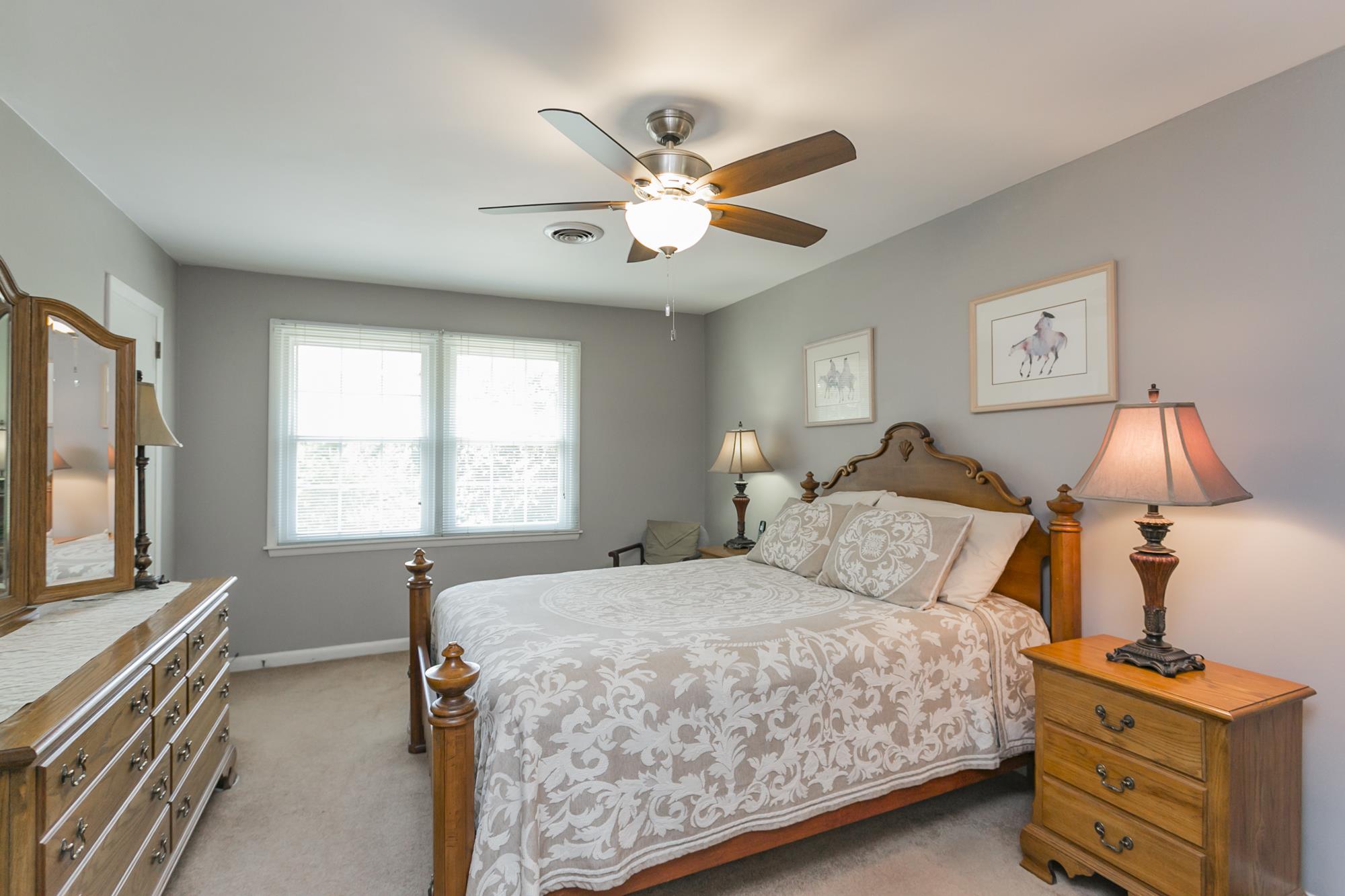 605 Baton Rouge Court Hermitage, TN 37076 - Photo 14 of 24 a bedroom with a bed and a chandelier