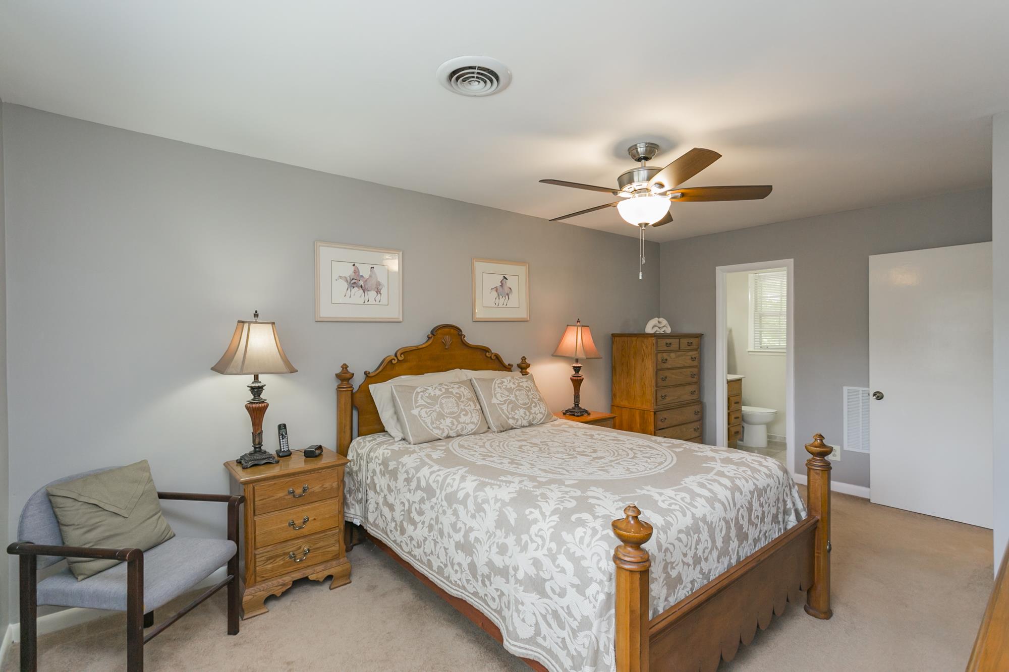 605 Baton Rouge Court Hermitage, TN 37076 - Photo 15 of 24 a bedroom with a bed and a chandelier