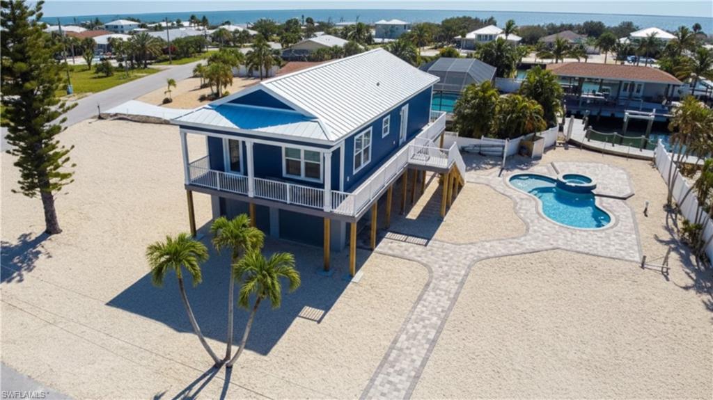 1 Fairview Boulevard Fort Myers Beach, FL 33931 - Photo 43 of 48 a view of a house with pool and chairs