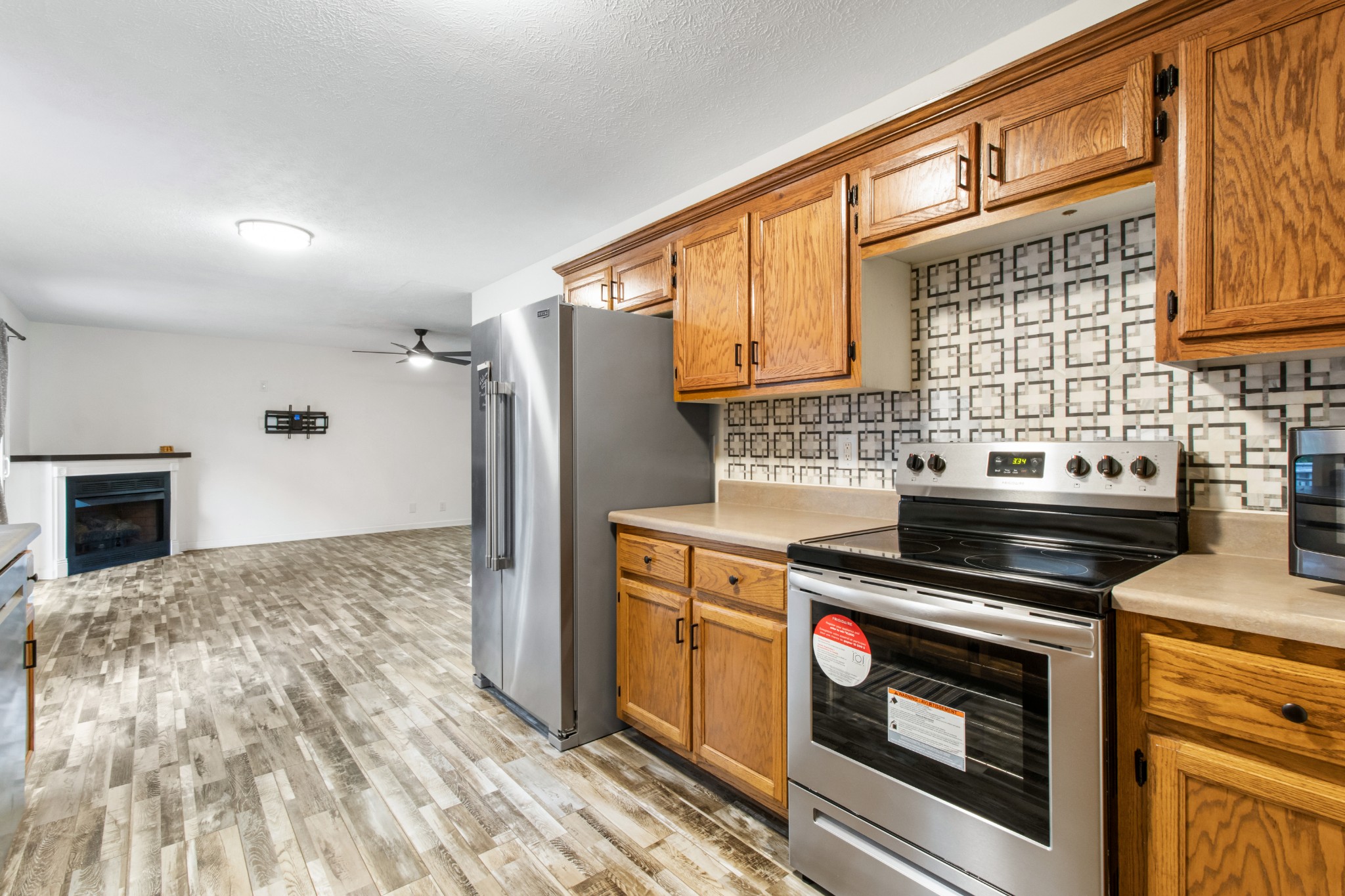1760 Hazelwood Road Clarksville, TN 37040 - Photo 13 of 34 a kitchen with a stove a sink and a refrigerator