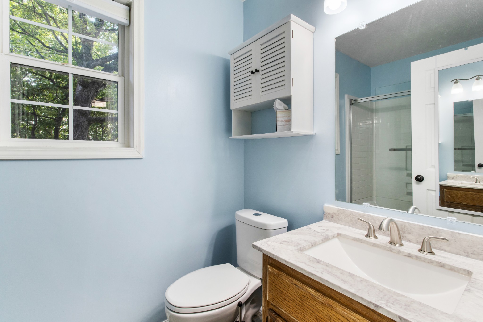1760 Hazelwood Road Clarksville, TN 37040 - Photo 21 of 34 a bathroom with a sink a toilet and mirror