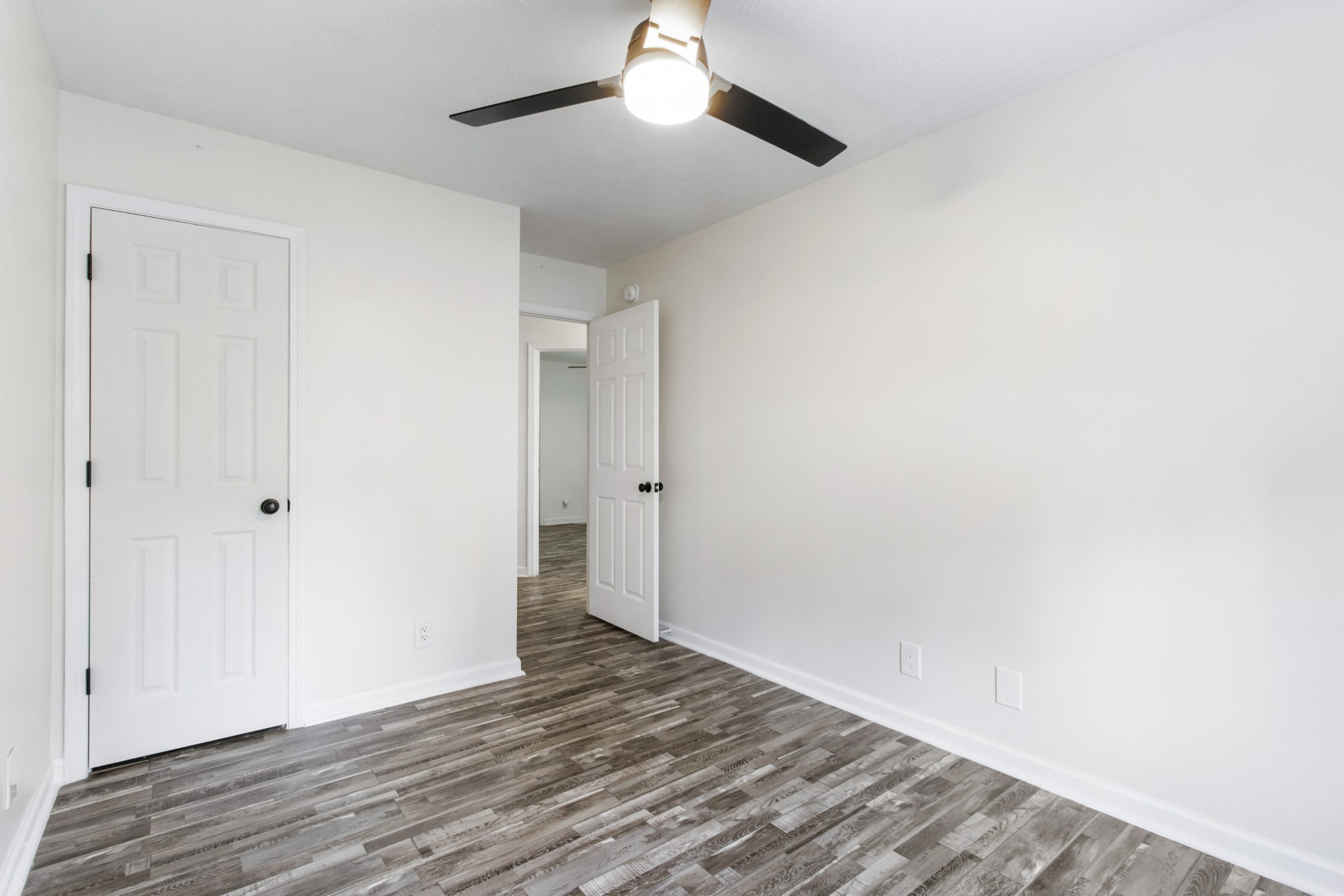 1760 Hazelwood Road Clarksville, TN 37040 - Photo 24 of 34 a view of an empty room with wooden floor