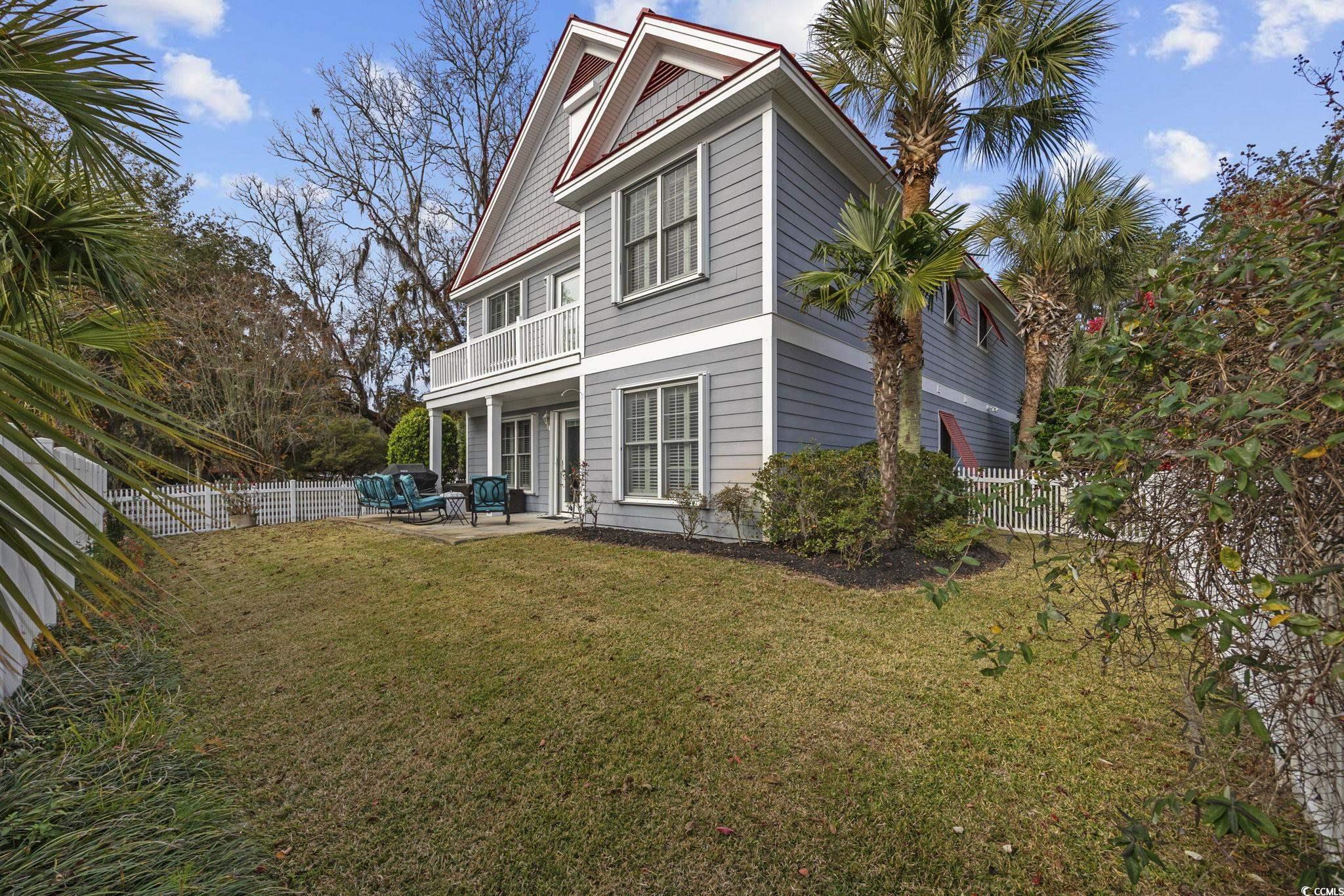 4398 Murrells Inlet Road Murrells Inlet, SC 29576 - Photo 6 of 38 Back of property featuring a patio area and a fenced backyard