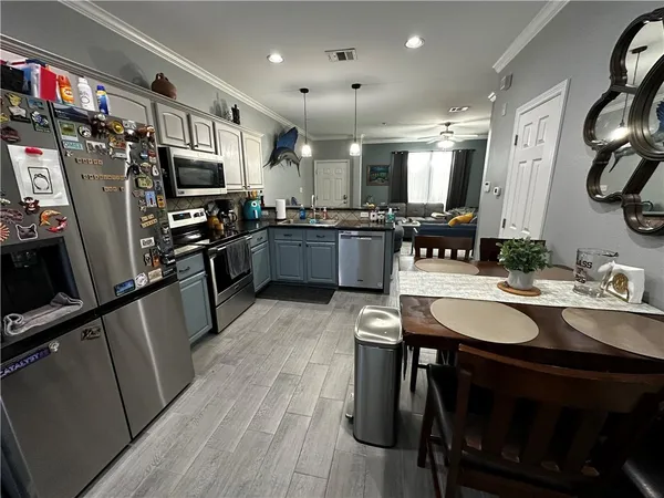 a view of a patio with chair and tables