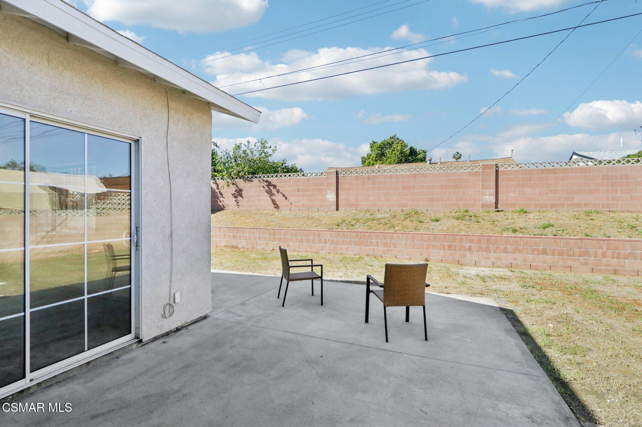 12745 Muscatine Street Pacoima, CA 91331 - Photo 24 of 35 a view of a swimming pool and a chair