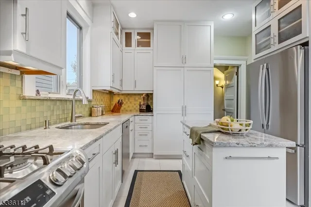 a dining room with furniture a rug and wooden floor
