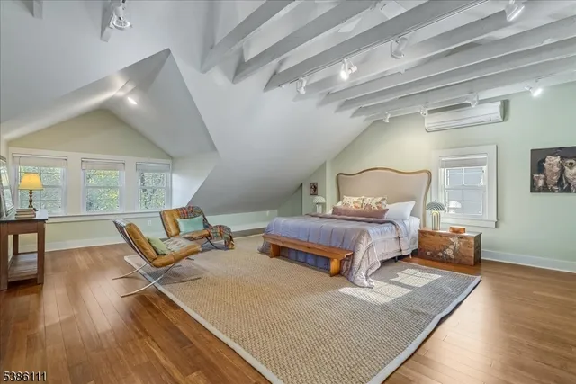 a bedroom with bed and window