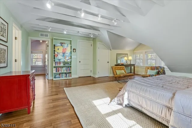 a bathroom with a sink a mirror and a shower
