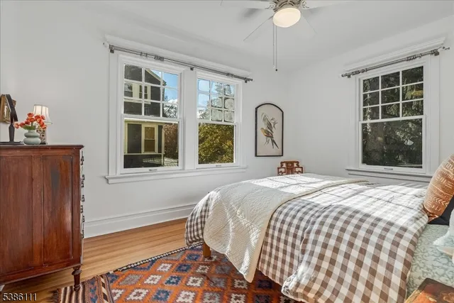a bedroom with furniture and a window