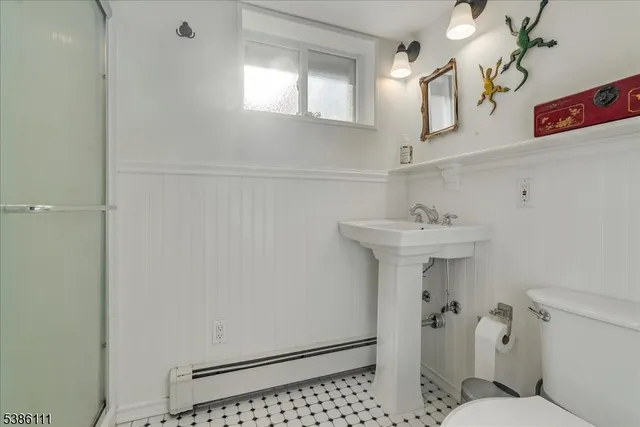a view of a dinning table and chairs in patio of the house