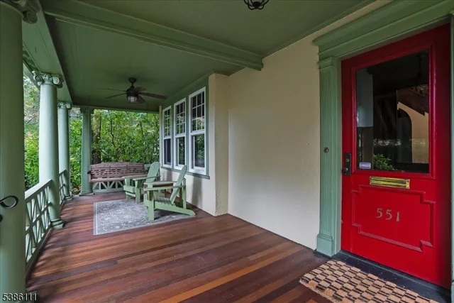 a view of two chairs in the balcony