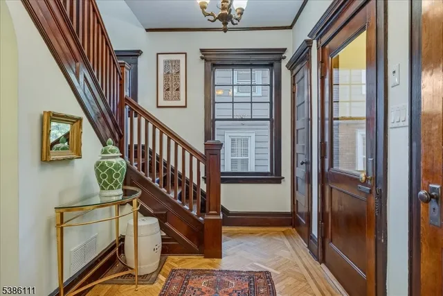 a view of hall way with staircase