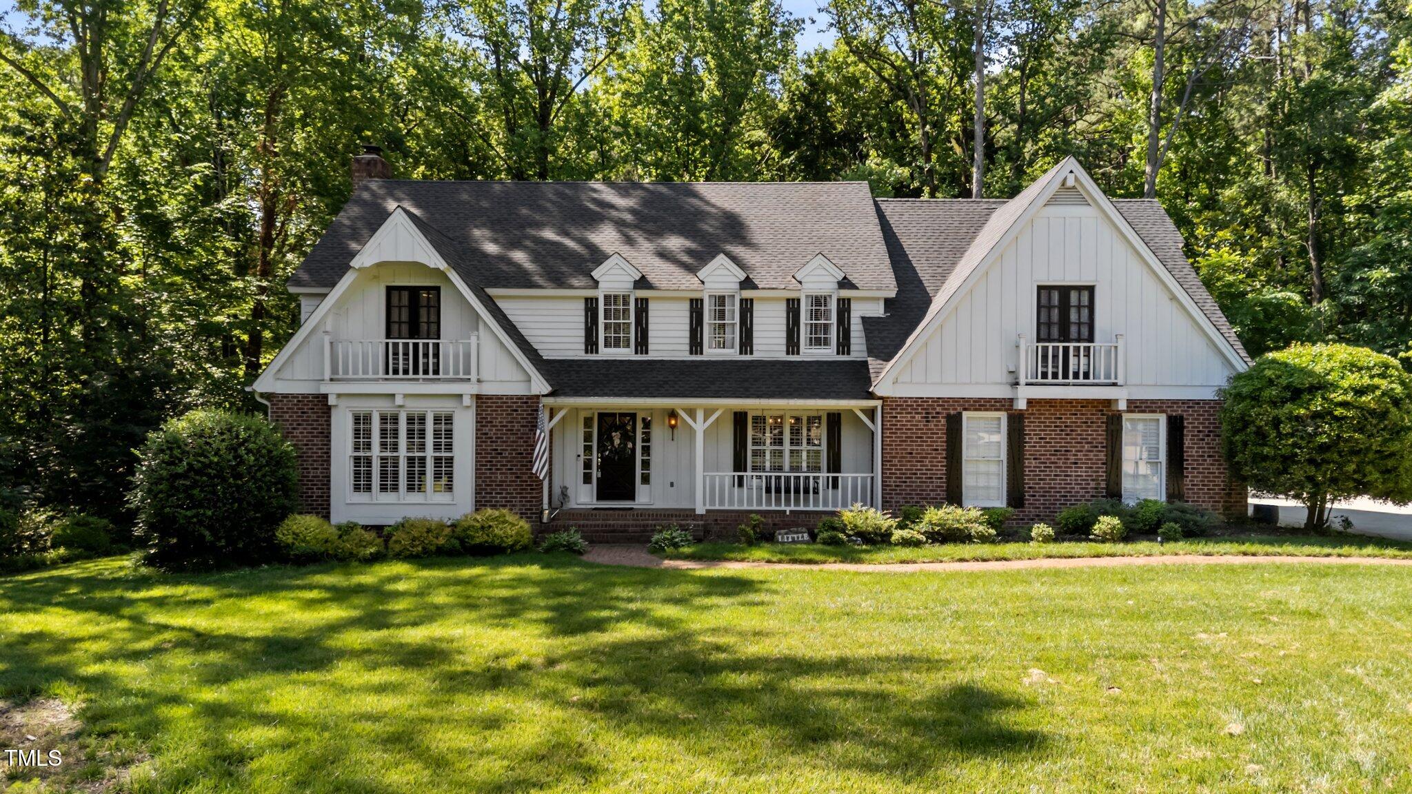 2409 Beechview Court Raleigh, NC 27615 - Photo 1 of 46 a front view of a house with a yard