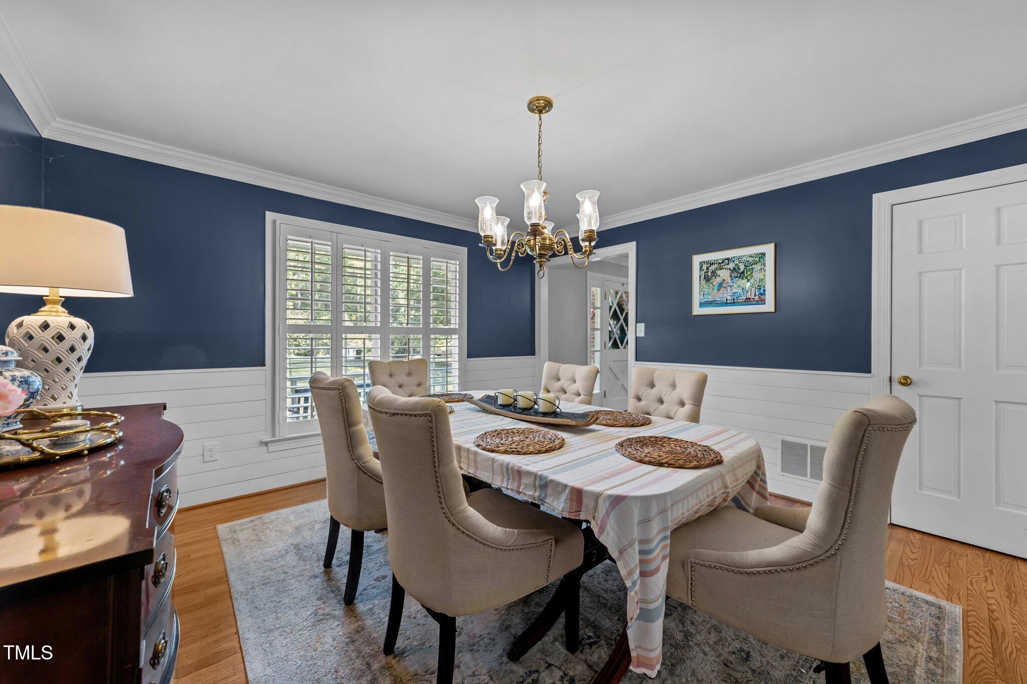 2409 Beechview Court Raleigh, NC 27615 - Photo 18 of 46 a view of a dining room with furniture window and wooden floor