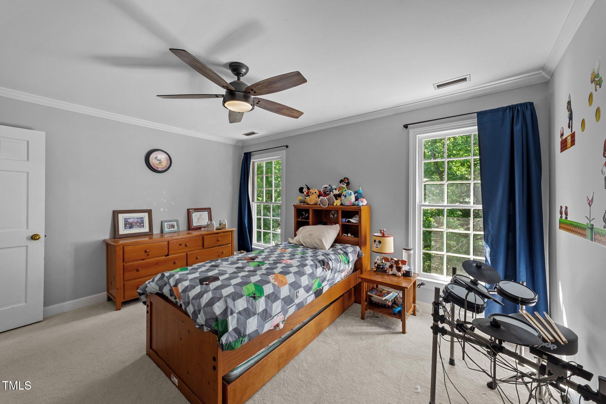 2409 Beechview Court Raleigh, NC 27615 - Photo 25 of 46 a bedroom with a bed and a window