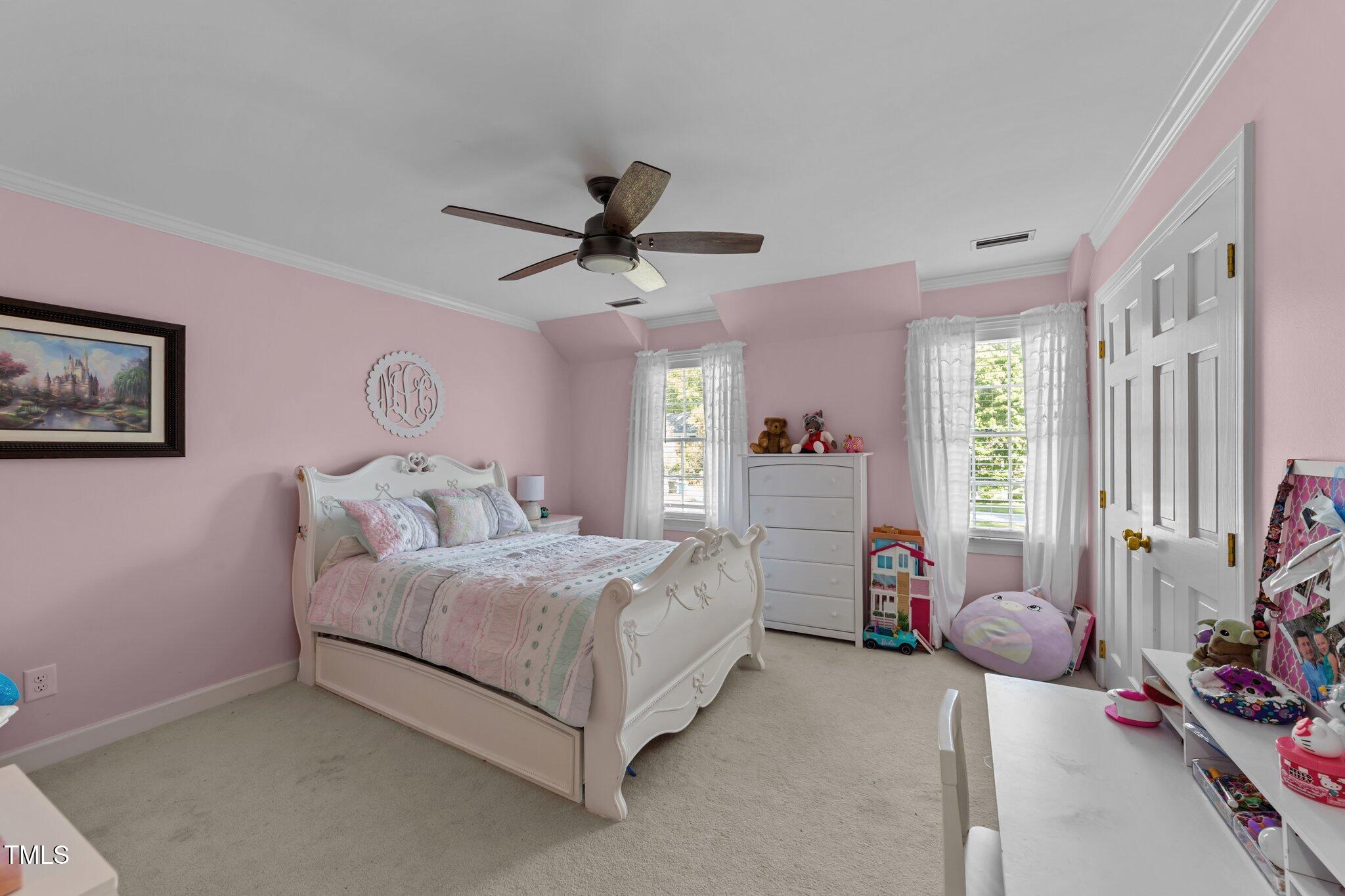 2409 Beechview Court Raleigh, NC 27615 - Photo 26 of 46 a bedroom with a bed couch and a window