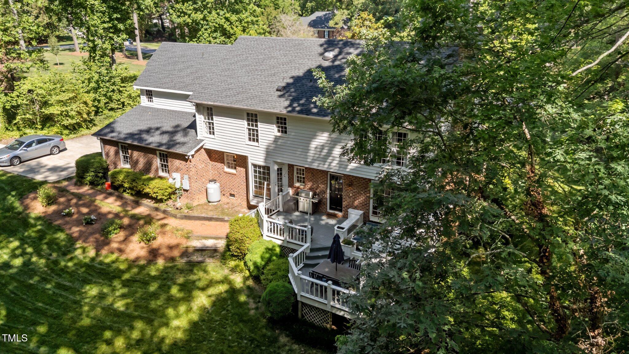 2409 Beechview Court Raleigh, NC 27615 - Photo 32 of 46 a view of a house with a yard