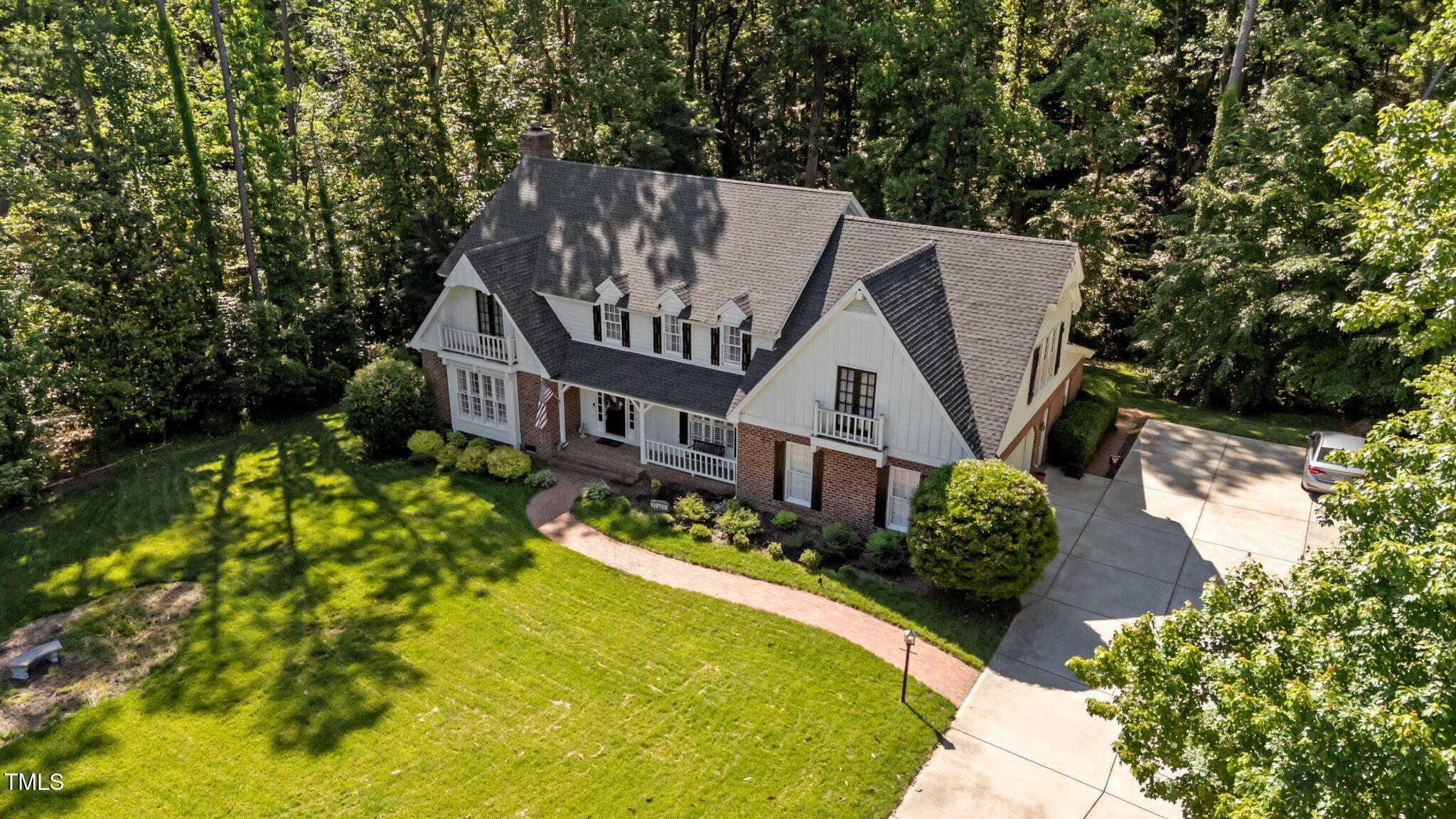 2409 Beechview Court Raleigh, NC 27615 - Photo 38 of 46 a aerial view of a house with swimming pool and garden