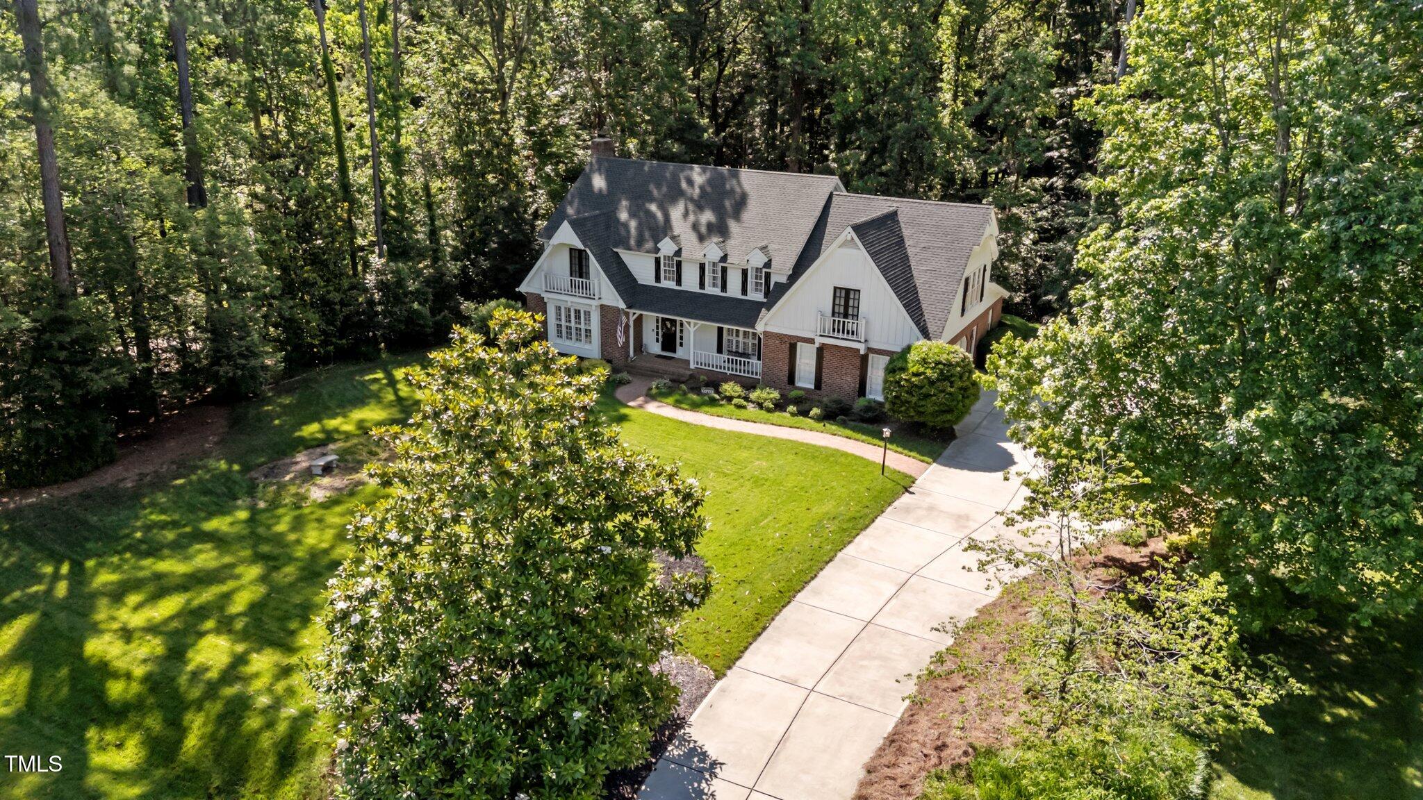 2409 Beechview Court Raleigh, NC 27615 - Photo 39 of 46 an aerial view of a house with swimming pool and garden