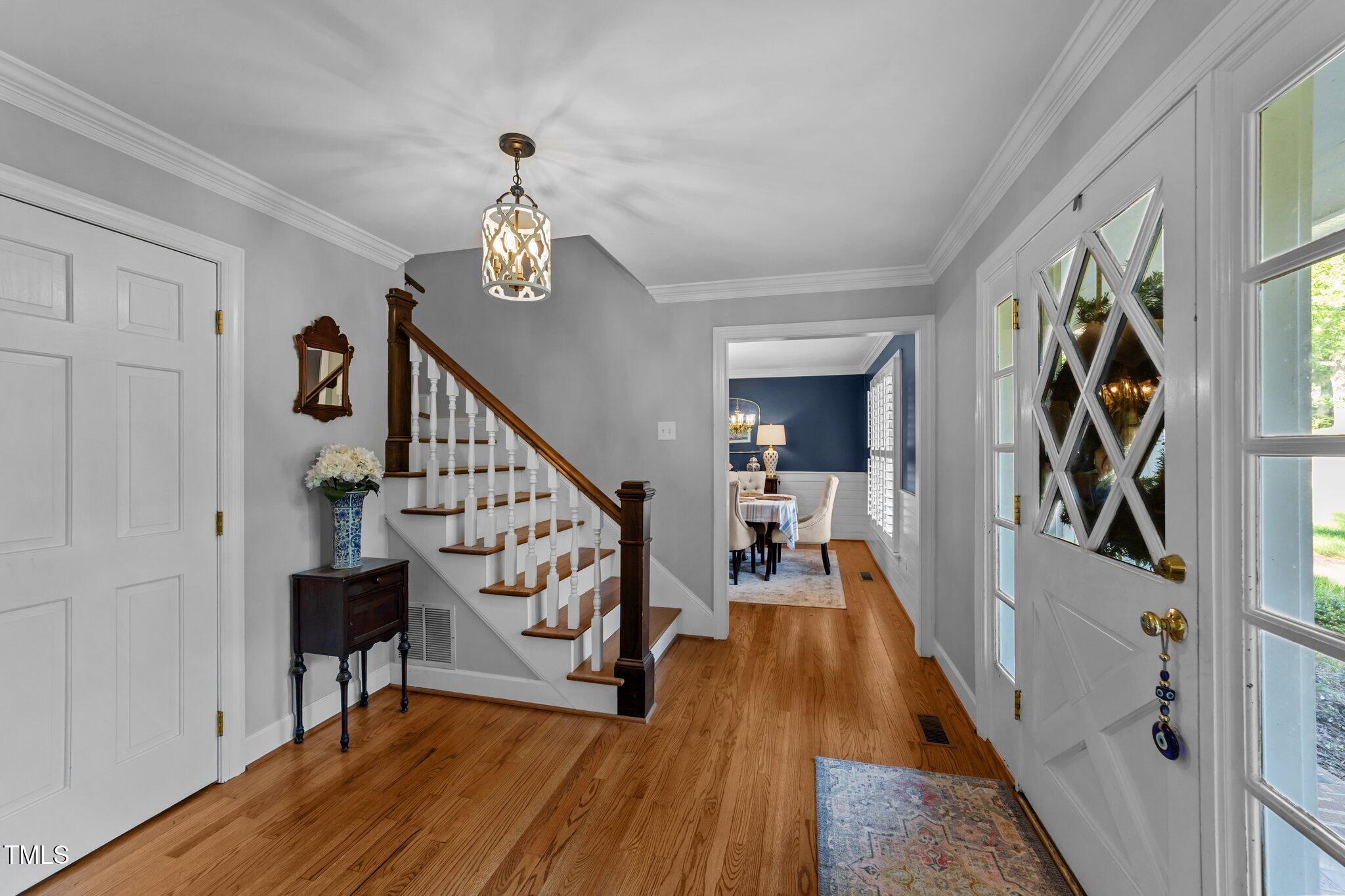 2409 Beechview Court Raleigh, NC 27615 - Photo 5 of 46 a view of entryway and hall with wooden floor