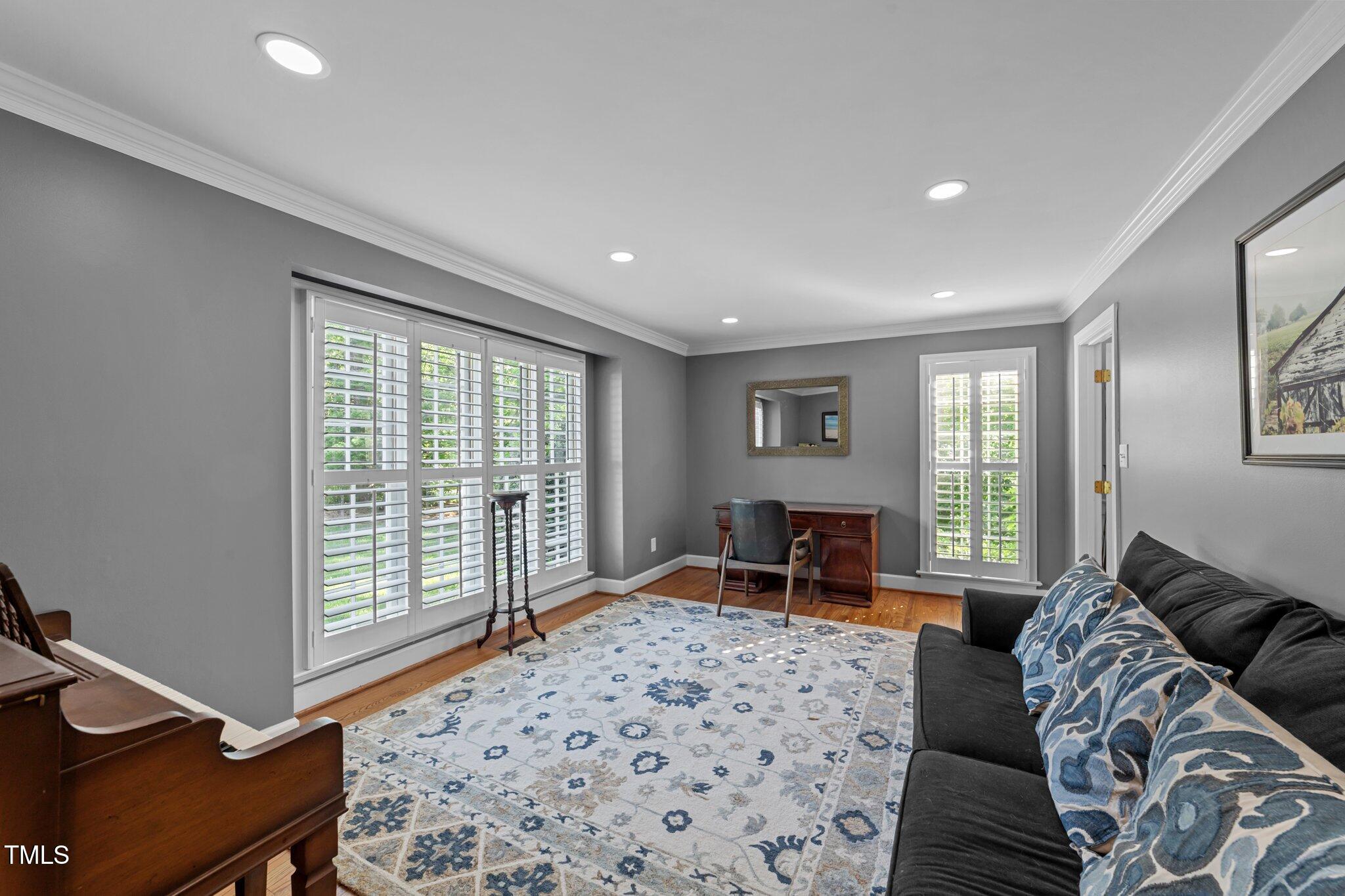 2409 Beechview Court Raleigh, NC 27615 - Photo 7 of 46 a bedroom with furniture and a window