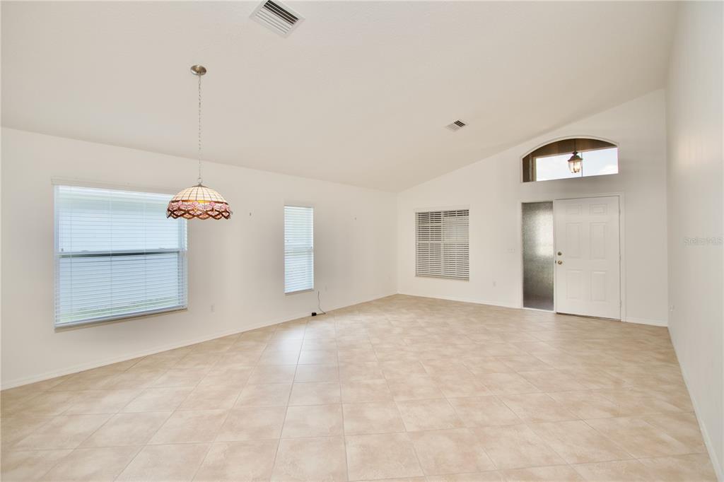 7842 Tenby Court New Port Richey, FL 34655 - Photo 2 of 27 a view of an empty room with a window