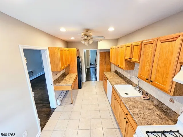 a bathroom with a sink a mirror and a shower