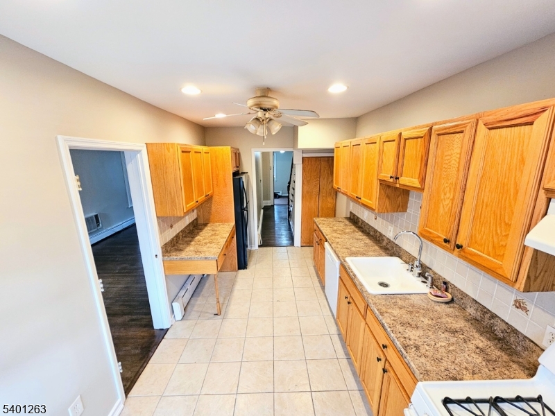 232 Morris Avenue Summit, NJ 07901 - Photo 11 of 13 a bathroom with a sink a mirror and a shower