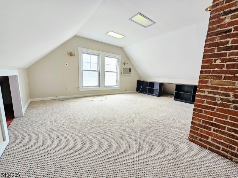 232 Morris Avenue Summit, NJ 07901 - Photo 13 of 13 a view of an empty room with wooden floor and windows