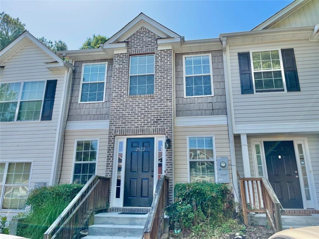 2922 Vining Ridge Terrace Decatur, GA 30034 - Photo 1 of 1 a front view of a house with glass windows and plants