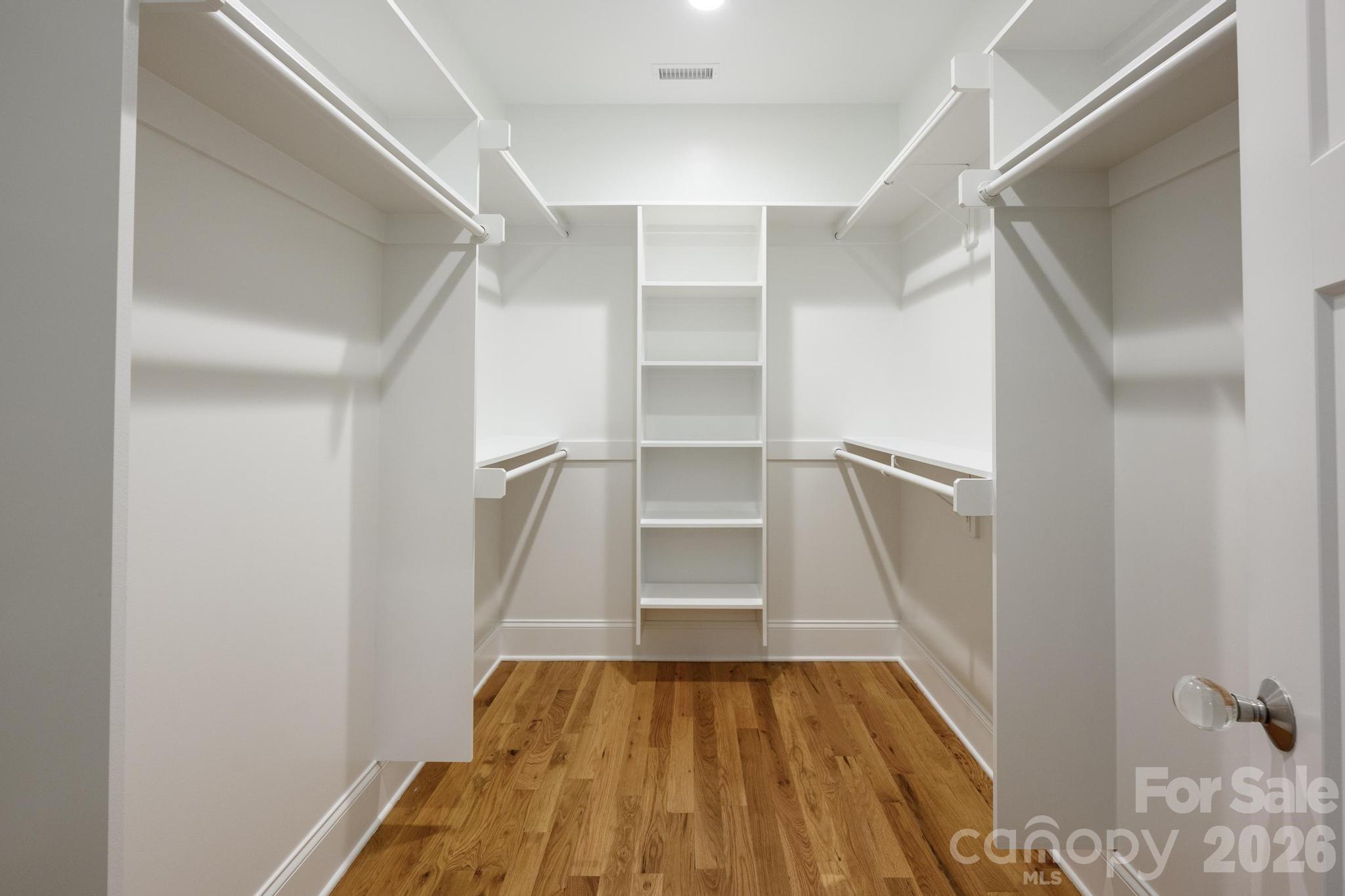 735 Emma Claire Lane Davidson, NC 28036 - Photo 19 of 48 a view of walk in closet with empty racks