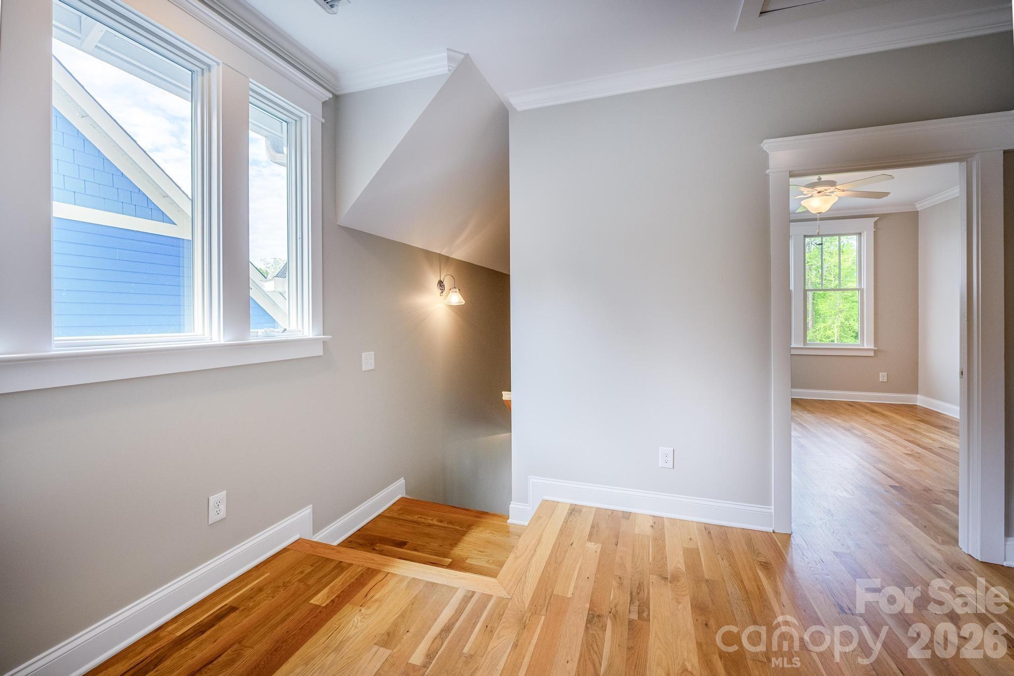 735 Emma Claire Lane Davidson, NC 28036 - Photo 22 of 48 a view of room with window and wooden floor