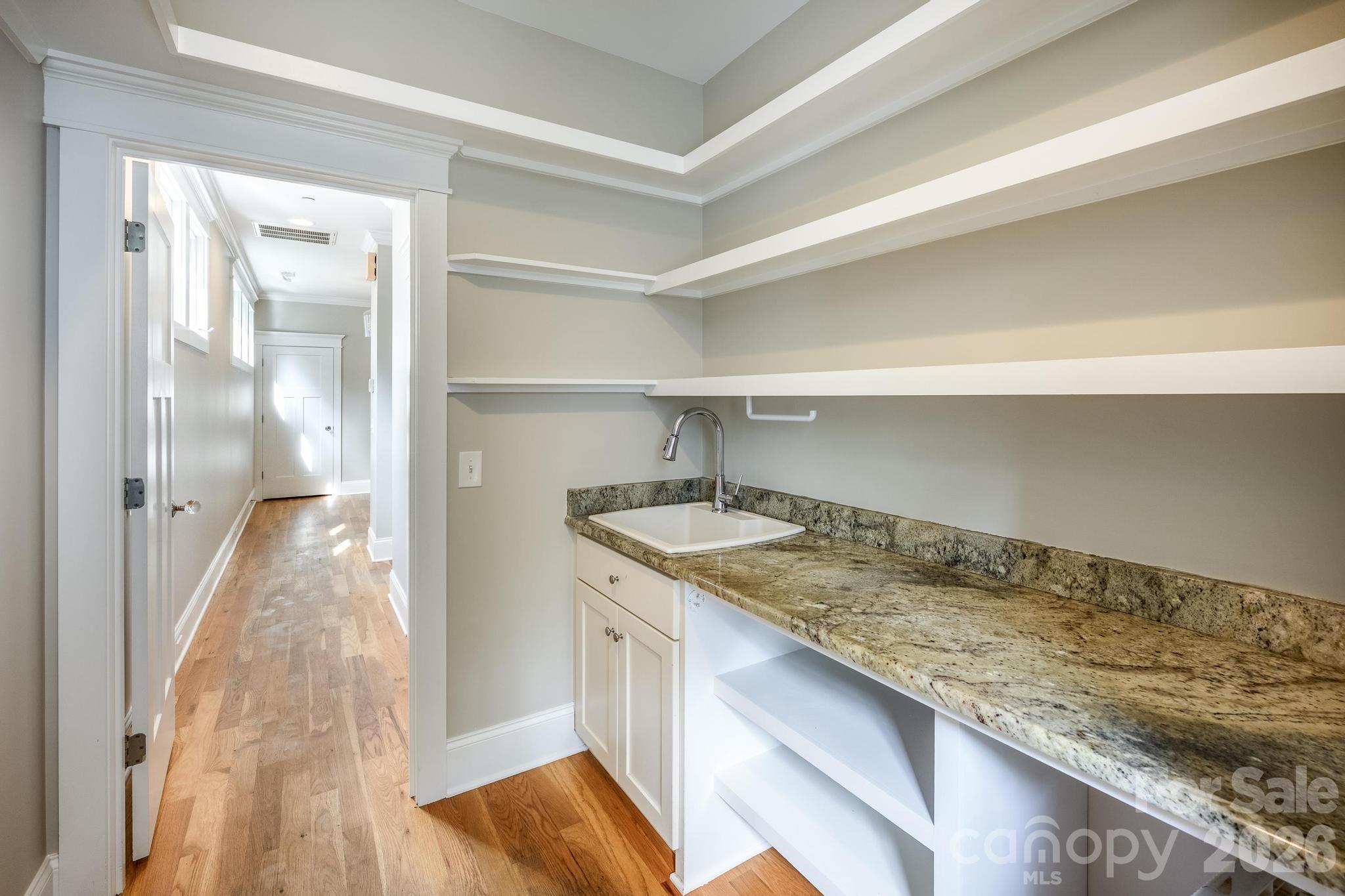 735 Emma Claire Lane Davidson, NC 28036 - Photo 32 of 48 a kitchen with a sink stove and refrigerator