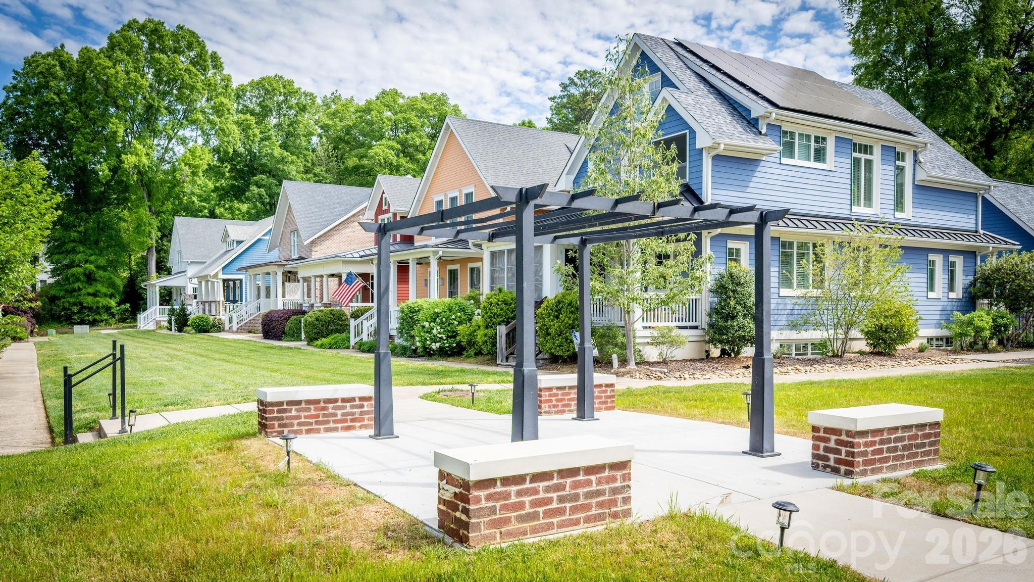 735 Emma Claire Lane Davidson, NC 28036 - Photo 40 of 48 a view of a house with swimming pool and a yard