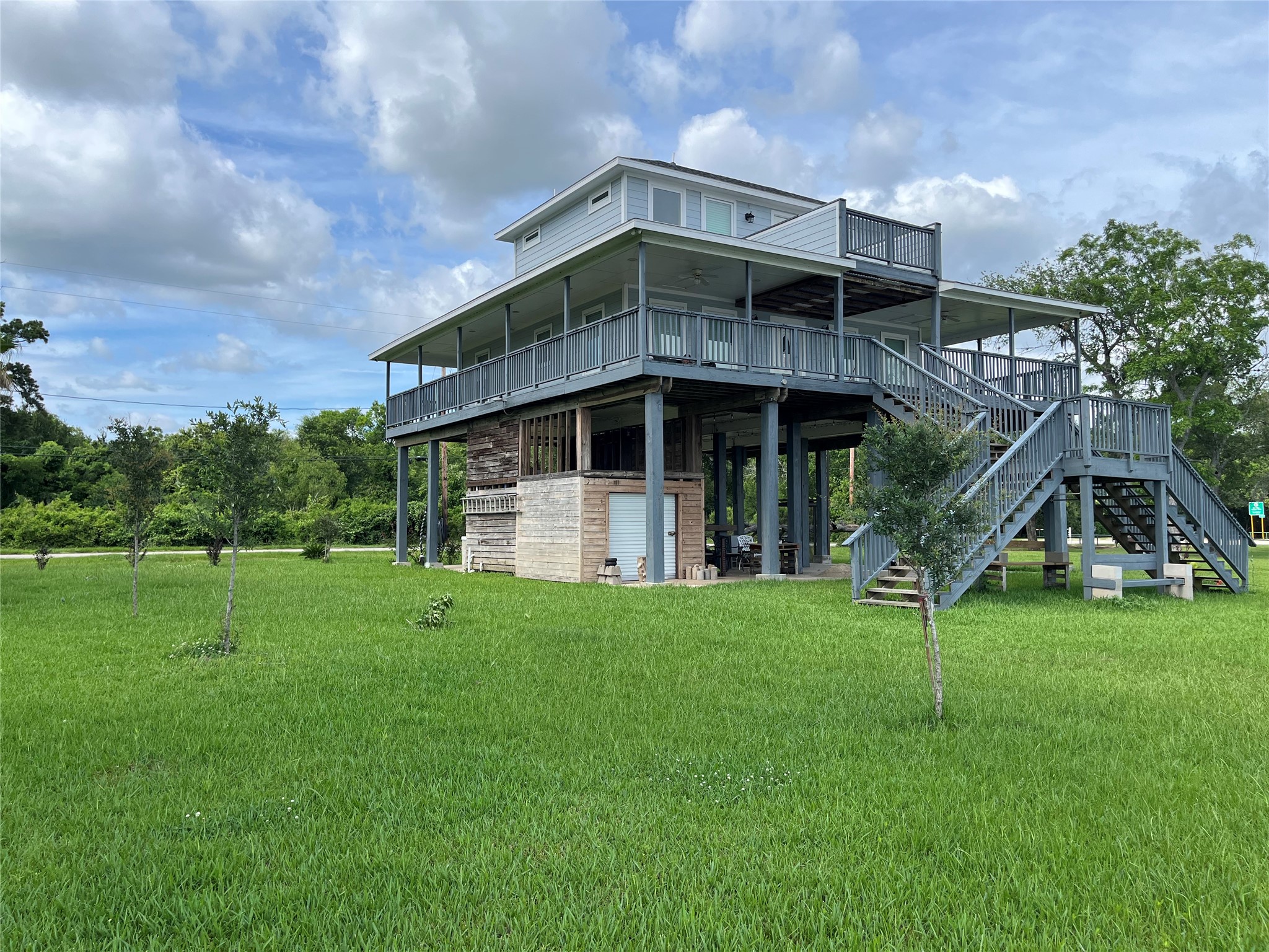 21511 Rio Villa Drive Houston, TX 77049 - Photo 12 of 45 a view of a big house with a big yard and large trees