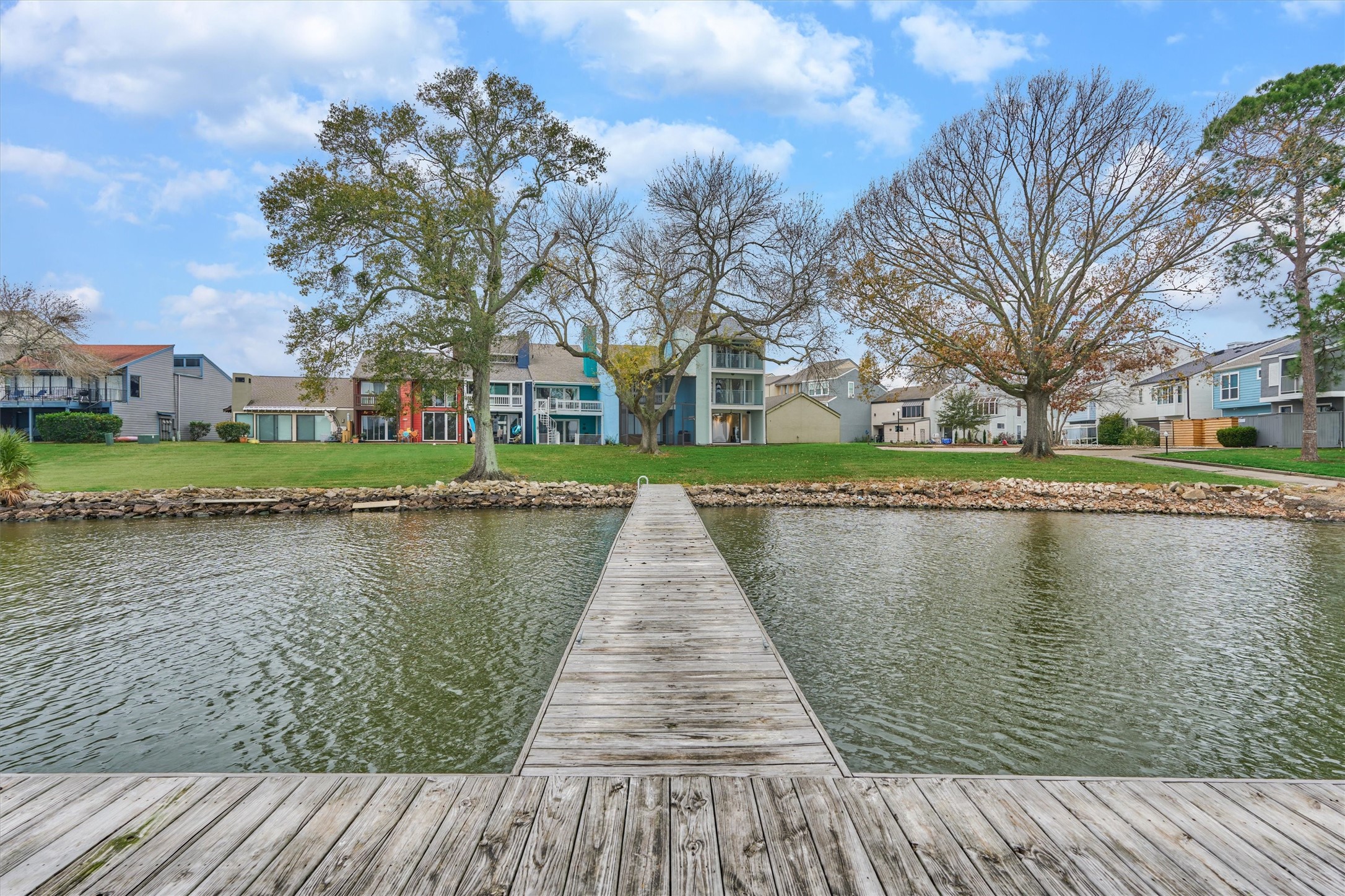 1427 Bowsprit Point Willis, TX 77318 - Photo 39 of 47 The view from the pier back toward the townhome.