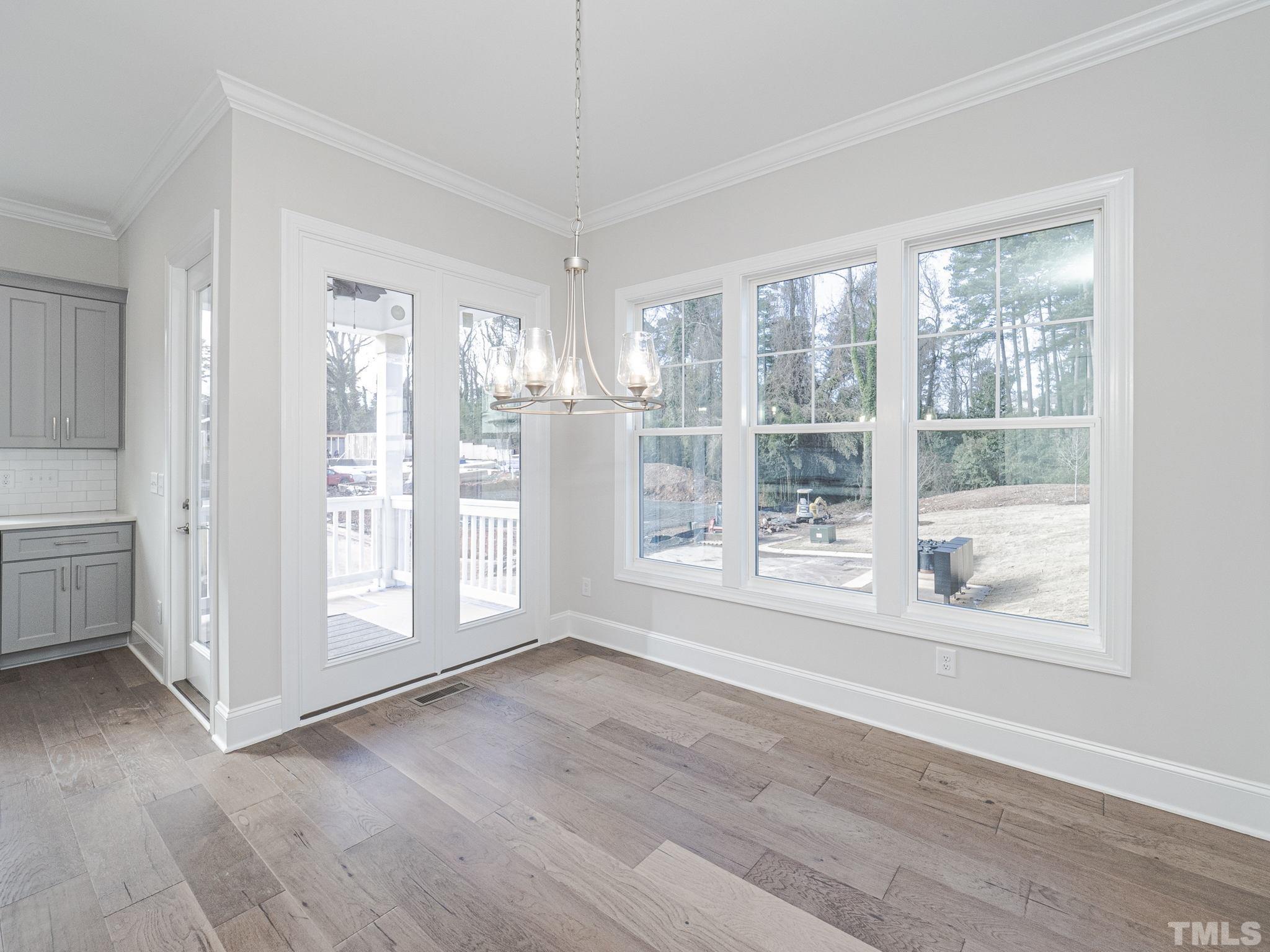 4920 Trek Lane Raleigh, NC 27606 - Photo 13 of 31 a view of entryway with wooden floor