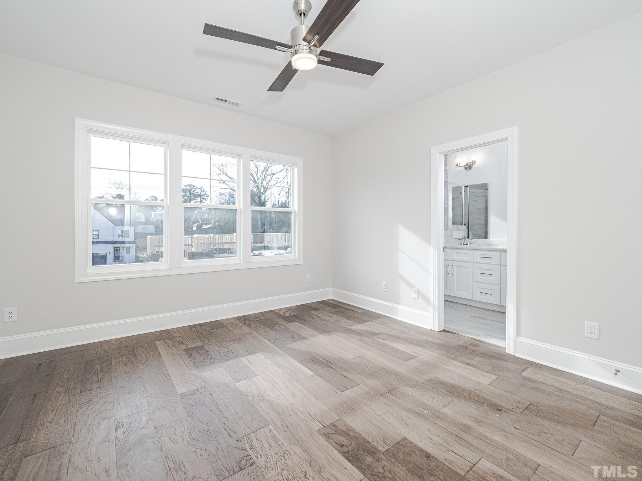 4920 Trek Lane Raleigh, NC 27606 - Photo 23 of 31 wooden floor in an empty room with a window
