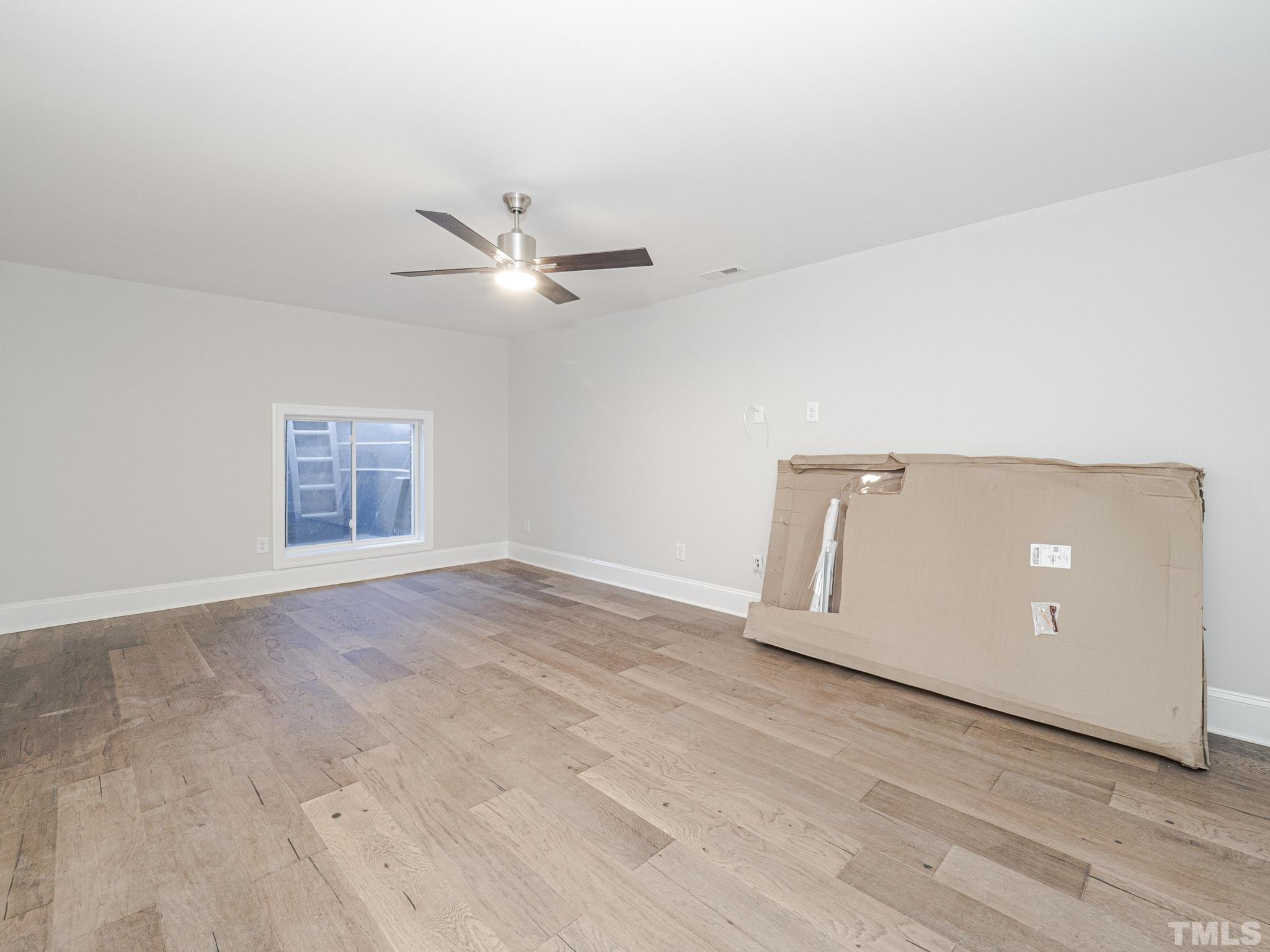 4920 Trek Lane Raleigh, NC 27606 - Photo 25 of 31 an empty room with closet and a ceiling fan